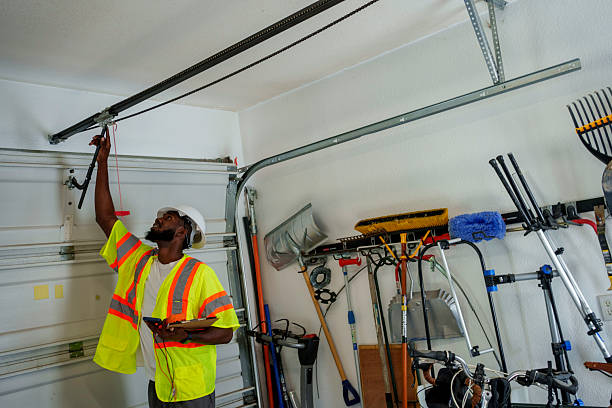 Professional Garage Door Panel Replacement technician working in East Patchogue, NY